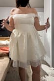 Super cute dress but the under layer of mine was wayyyy longer than the model's or any of the review photos. Ended up completely pinning it up because it looked silly. Was loose on the bust part, but I did order a large - worried about my waist, which fits perfect. Overall, a cute dress, will be wearing it to my rehearsal dinner. - Morgan H.