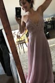 Ordered a medium, fits like a glove. Has adjustable criss cross straps in the back so you can adjust according to your chest and how low you want the V in the front. The lace detail is sexy and flattering. I appreciated that the bottom half of the dress didn't have a ton of extra fabric so it didn't make me look wide in the hips (I am curvy). It was a flattering cut. The color is spot on how website show it. Love this dress! - Malia D.