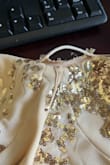 This dress was ripped at the bustline, and we didn't notice it until after my daughter took off the tag and went to wear it.  It is clearly a flaw in the material, but I can't return or exchange it because the tag is off. - Carolyn T.