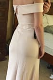 The fabric was nice and thicker than expected. It definitely would need to be hemmed even with heels. Unfortunately the dress rolled at the back of the top zipper to where you could see the inside of the dress and tag. - Jasmine A.