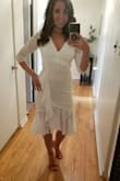 Just loved this lacy white dress! It fit perfectly. The length was great with the different levels. Although material is white it is higher quality, so you don't see straight through. With the half sleeves it's a nice dress to wear for cooler weather. - Gina O.