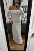 I ordered a size S but the sleeves were too tight. I wasn't able to zip the dress by myself; the zipper is hard. - Jennifer V.
