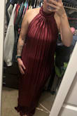 I wanted to like this dress SO bad. It's so elegant looking in the pictures, but once I got it, the material looked cheaper even though it technically isn't. Also, I expected the skirt to go either straight down or out a tad to be more gown like. It goes down and almost in some (?) I don't know how to explain it. I usually wear a medium in everything but ordered a small based on reviews, and it fits great. So I would suggest sizing down 1 - Logan S.