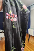 The dress came damaged. The flower stitching was hanging apart. The flowers fit where they were supposed to. It was very long for me. - Nam G.