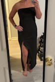 I truly rely on these reviews when buying a dress, so I wanted to help the next girly out! This dress is amazing and does NOT hug your midsection. I am usually between a medium and large, and got a large, and it fits perfectly, but I don't like things being tight at all - Arleigh W.