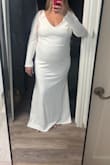 This dress was too short for me and just didn't fit well enough for my liking. I'm 5'8, 220 lbs and 25 weeks pregnant. I thought it would be long enough but it's short in the front. The fabric was okay but I don't know if I love it. - Emily M.