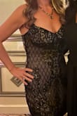 I loved this dress! It's sexy, comfortable, and looks really nice on. Runs a little small, I got a Large after reading reviews and was glad I did. Sparkles beautifully, which isn't captured in the pictures. Can't wear a bra with it, but it has adjustable straps. I received a lot of compliments and had fun wearing this dress to a Halloween Wedding. - Sondra R.
