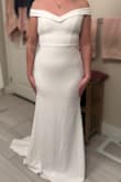 I bought this dress, worried it would be a little too simple, but it's beautiful. It hugs the body really beautifully. Definitely so happy with my dress. - Vanessa G.