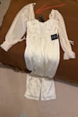 The jumpsuit came with different sleeves. Not possible to wear. Now I need to pay for the return or alteration. Think twice before buying this. - Nataliya G.
