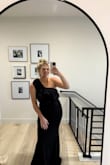 I absolutely loved this dress! So flattering and cute. It's a stretchy material - Lauren