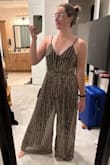 Ugh, this is just THE most beautiful jumpsuit! So sparkly and classy, and it's also extremely comfortable, which is not what I expected. The fabric is unbelievably soft and lightweight for such a sparkly material!! My main issue and the reason I'm returning it is that I have a long torso, and it was just a tad bit too short through the torso to be comfortable. The straps are adjustable, but I felt like it left my chest too exposed if I loosened them enough to not have it tight in the crotch. Otherwise, I'd keep this baby in a heartbeat!!! The leg length was perfect to wear with some short heels. I'm so sad because this is the perfect outfit for a NYE wedding!! I could dance all night in it. The fabric does tend to get caught on itself, as other reviews have mentioned, but it's not a big deal, and I was able to easily just shake the fabric a bit, and it sorted itself out. - Emma V.