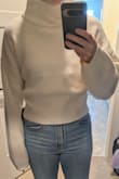 I was super excited about this sweater because it looks so cute in the picture! But when it came and I tried it on, I just couldn't make it work. The sleeves are really long, you can hardly see my finger tips when my arms are relaxed at my sides. And the sweater rests on my hips (which are not wide) in an unflattering way. I get a mushroom-like effect where the top pattern meets the bottom. Will be returning - Samantha H.