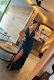 This dress was the perfect wedding guest dress (location was rooftop/beach). I got a Large, and it was true to size. The dress was unbelievably comfortable, and I received an insane amount of compliments. I did sew up the slit a tiny bit just because I liked the look better. It is also fairly long, though, if you are short. I'm 5'7 and wore heels that were about 3ish inches tall, and the dress still was basically reaching the floor, which was perfect for me. - Ashley M.