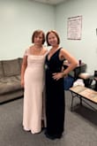 This dress is amazing, very classy and chic. The v neckline was deep for me but a little double sided tape and it was perfect. I got lots of compliments. The fabric color is rich and luxurious - Kelly H.