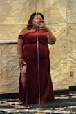 I am a true size 18 and short. I wore 3in heels and no alterations needed. I did need to hold my dress a little when I walked. The weight of the dress was perfect. Well made and the material felt expensive. The color was like the picture. Beautiful rust. Definitely will buy more from Lulu's. - Ronica O.