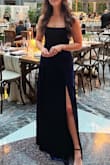 I loved this dress! I purchased a size Medium. I am small-chested and wore Cakes with the dress and had a friend lace up fairly snug to fit well, which is fine; that is the beauty of the dress. It can fit many bust sizes well. The dress is very long. I am 5'9" and wore 2.5 inch heels, and the dress hit the floor. For anyone - shoes included - shorter than 5'11", you may have to hem it. The slit is high, but there is enough fabric in the bottom half of the dress that it is not very prominent and never felt immodest. Overall loved wearing the dress, received many compliments and hope to wear it again next winter! - Courtney R.