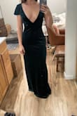 I really liked this dress, but felt it was too exposed in the chest for the event I needed a formal dress for. I had a low heel on, it was a little long for me, I'm 5'3", but perhaps a taller heel would work or an easy hem. I tried it on with a long teardrop necklace, and it looked great. I recommend it. I just went with something else. Please excuse the dirty mirror and messy bedroom! - Jill T.