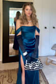 Got this gown for a black tie wedding downtown Chicago in November. I love the way this gown drapes across my body in all the perfect places, making me feel like I should be presenting at the Oscars! The material is heavy enough that I was comfortable at cocktail hour outside under the heat lamps, and breathable enough that I was just as comfortable inside at dinner. The slit was much higher than I expected, which made it a little awkward when sitting and crossing my legs, so be wary of that! And you definitely need to take some time steaming it prior to wearing. Other than that, I got so many compliments on the style and color, and I felt like a Bond girl the entire evening! - Allison D.