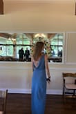 I absolutely loved this dress! It was super fun and a great colour. The material was thick, covering anything worn under the dress. There was a stickier band around the bust and an adjustable strap to help hold the top component in place. Overall, definitely 10/10 recommend!!! - Mackenzie W.