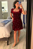 I first got an extra small, but it was too tight around the stomach. I could not sit down comfortably in it. I then got a small which fit much better. However, the sleeves were too large and slipped off my shoulders. I fixed that with a little double-sided tape. Overall, the dress looks good, and I'll be wearing it to an upcoming holiday show. There is some tulle at the bottom of the dress that makes it poof out into this shell like shape. Some of the comments say it's very itchy. I definitely noticed the texture, but it isn't bothersome to me personally. - Casey C.
