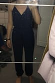 This is super nice and good quality! It fits me perfectly and I don't have to worry about accidentally showing something because the tie top is adjustable. Definitely recommend! I ordered a size small. - Catherine