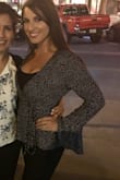 The pattern of this is very fun while it is also a very good professional shirt if you throw a tank on under it like I did! The fit is right around the waist but it's adjustable, but the looser you leave it, if you don't have a tank top on- your chest might pop out! Best for a smaller chest! - Tricia I.