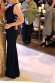 I had so many compliments on this dress. I wore it to a black tie wedding. The front is modest but the caging adds a nice flair. It's not super long so a nice 3" heel was ideal. Get it! - Katherine M.