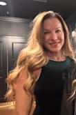 The dress is very pretty. The color is perfect for a holiday party or a night out! It fits true to size. The open back is sexy but classy! It adds the perfect touch to the dress. I only have one picture but it isn't a full picture of the dress. Trust me, it is beautiful! - Kelly B.