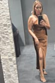 Hugged me in all the right places. The waist was fitted but not restricting. The top was a little long so I tied it like a previous review suggested and it was perfect! I did fill in the top, causing the criss-cross neck to have an opening at the chest and expose a bit of cleavage (as seen in picture). Felt sexy and classy! - Marisa C.