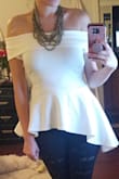 Great top! Love the asymmetry. Fit true to size. I get compliments every time i wear it. - Amy S.