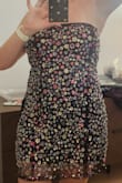 There are two black lines that run down the front of the dress that have no sequins. This was not shown in the listing photo. Otherwise I would have loved it! The length is perfect, but it's too loose around the bust. A size small would have fit better. - Lindsay G.