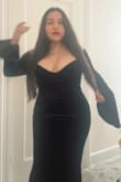 This dress is very elegant. It hugs your curves beautifully and complements an hourglass silhouette. The black velvet fabric elevates the whole look and the bell sleeves add a unique touch. Although I'm a short person, with the appropriate heels, the dress elongated my figure and looked incredibly polished. Very happy with my purchase! - Sarai F.