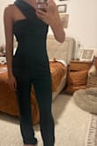 Very long. If you're a short girly you'll have to have it hemmed. Fit a little weird and lumpy in the chest area. Pretty color, just wish it fit better. - Taylor L.