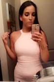 I just love this dress. The beautiful blush pink and lace detail on the back make me feel so feminine when I'm wearing it! The material is thick and stretchy. Great dress - Gisela G.