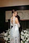 I wore this stunning piece as my second look during my wedding. I felt chic and confident! Yes, the boning in the top is a bit odd, but it does hold the dress in place. I didn't wear any sort of bra and danced all night. I added the gloves and necktie - both separate purchases from different companies - and all the lace matched perfectly. - Amber S.