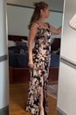 The fit of the dress is true to size. I did need to get the straps shortened. The dress was pretty long even with heels on, so I had to get it hemmed. The material is very nice & comfortable. I was pleased with this purchase. - Heather D.