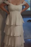 I was going to return the dress because the top part was very loose and didn't look right. However, I bought a different bra and made it work. I also bought a cardigan since my bridal shower is in the winter. - Autumn H.