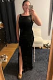 This dress is super comfortable. Originally ordered a large and returned it to size down to a medium. It looks beautiful and is super flattering. It's a bit long, and I am taking it to get altered. There was a slight rip in the shoulder, and the zipper is stuck, so that's why I couldn't give it 5 stars. - Teresa F.