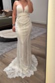 This dress was beautiful, the lace was delicate and pretty and I liked the color. Unfortunately is just ran really large based on their size chart. The lace hem is scalloped so it would be difficult to hem and keep the shape. I almost kept it and was going to pull up the material from the waist but decided against it. - Jaime L.