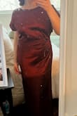 This is a beautiful, beautiful design. I bought this for a Casablanca-themed party that I hosted, and then bought it in real and green so I can have it for every formal occasion no matter the season. I ordered L and XL, and while L technically fits, I prefer the draped look and feel of the XL obscures my tummy a little better. The shoulders generally stay put if you have decent posture, but I'll think about securing them with tape if I go to a wedding or other situation where I'll be dancing. - Elizabeth R.
