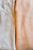 I absolutely love the fabric and style of this dress. However, the color is not as advertised. I bought the cream color, but it is much more peachy/apricot than cream. The color name and pictures were both misleading. I expected an off-white, maybe to beige, but this looks like a cream dress got washed in a load of red laundry. I'm including a photo of the dress fabric on the left compared to a solid white shirt I have (that has never been worn so it's still perfectly white) just as a color comparison. - Megan J.