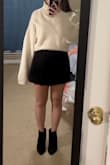 This is a really cute oversized sweater for fall/winter. I like pairing it with a skirt, either untucked or tucked. The ribbing at the bottom makes folding it under for a tuck very easy. The design on the front is very appealing, and the sweater isn't scratchy! Though I still wear a white tank top underneath. Couple caveats, I am pretty petite, and the mock neck is kinda tall, so sometimes I actually fold it over into a turtleneck. The sleeves are also very long, which is probably part of the style of winter sweaters. - Elizabeth F.