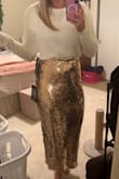 I'm athletic build. I got a large to go with this skirt and loved it. - Rachel B.