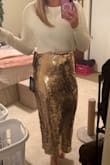 I'm athletic build, 180lbs with a smaller waist. I ordered the skirt in a medium and large. Both fit, but I like a more straight look, so kept the large. The pic is of the large. - Rachel B.