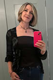 This top is just the right mix of sexy and dressy. I chose to wear it open, with a fitted satin cami underneath. - Tara T.