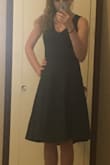 I am 5'4" 115 lbs, got a little vain and ordered an x-small probably should have ordered a small but can still get the zipper up so whatever. Material is pretty thick but it is nice. The length is right at my knees. The vneck shows some cleavage but nothing too scandalous. I would buy it again but I would order a small the next time... - Valerie W.