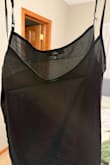 The underneath part of the dress was absolutely see through. The dress was tight everywhere and very very short. It hardly covered my bum. The material was so cheap and thin. The sheer part of the dress was good. - Janie K.