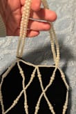 This is 1st product I've ordered from Lulus that I would say is poor quality. The pearls are very yellow. The straps are flimsy, and it almost seems like a little girl's toy. It looks and feels very cheap. It shouldn't be more than $10, and even then I wouldn't keep it. - Dina S.