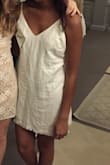 This dress is one of my favorite pieces to wear in the spring and summer! The fabric is durable, the fringe bottom is too adorable, and the cream color is perfect for all sorts of events. I love that I can adjust the straps to make the v-cut as deep or high as I want, but still keeping the dress not too short. One thing to note is that it wrinkles very, very easily (see pic), but if you keep it hung up and iron it every so often, you definitely need this dress! - Jasmine S.