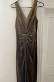 This dress feels very nice, with the two layers and good velvet it feels well made. However, the picture online for the olive green color is WAY off the real color. In the photo it looks very gold/copper colored but in reality the dress is very green. Pretty disappointed that the online photo wasn't accurate- especially for the price. - Emily L.